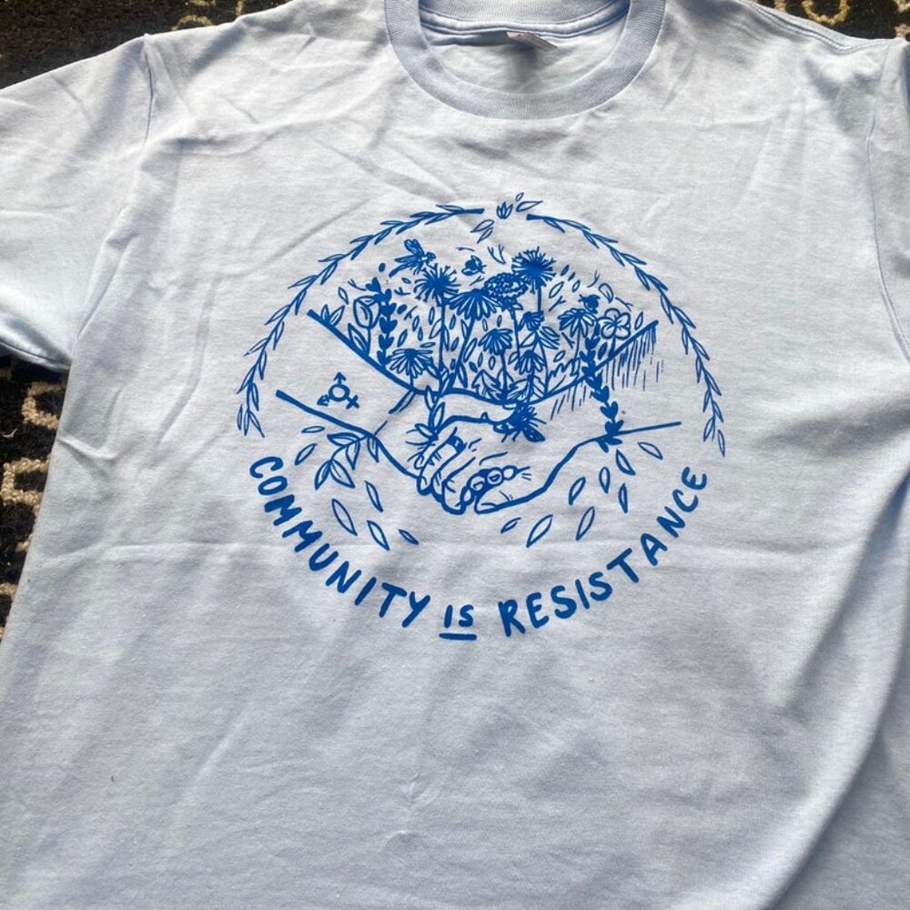 Community is resistance t-shirt